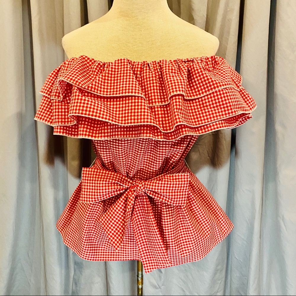 Ruffled blouse with belt.